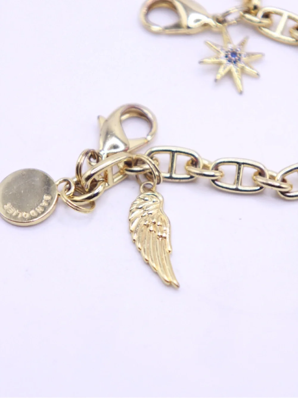 Bandolier Gold-Tone Charm Wristlet Bracelet with Star, Wing & Disc Charms - Picture 5 of 5